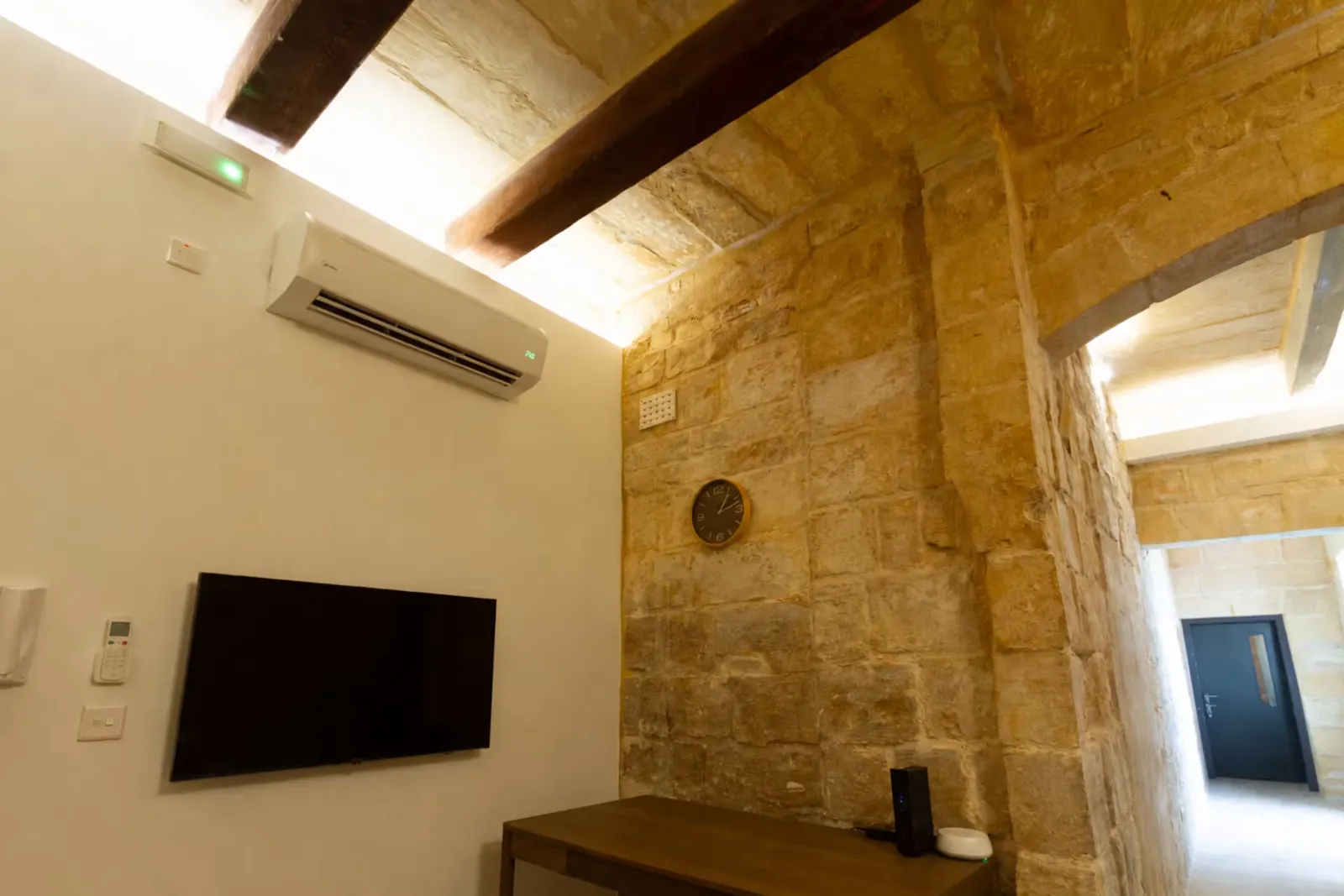 Wall-mounted TV and air conditioning
