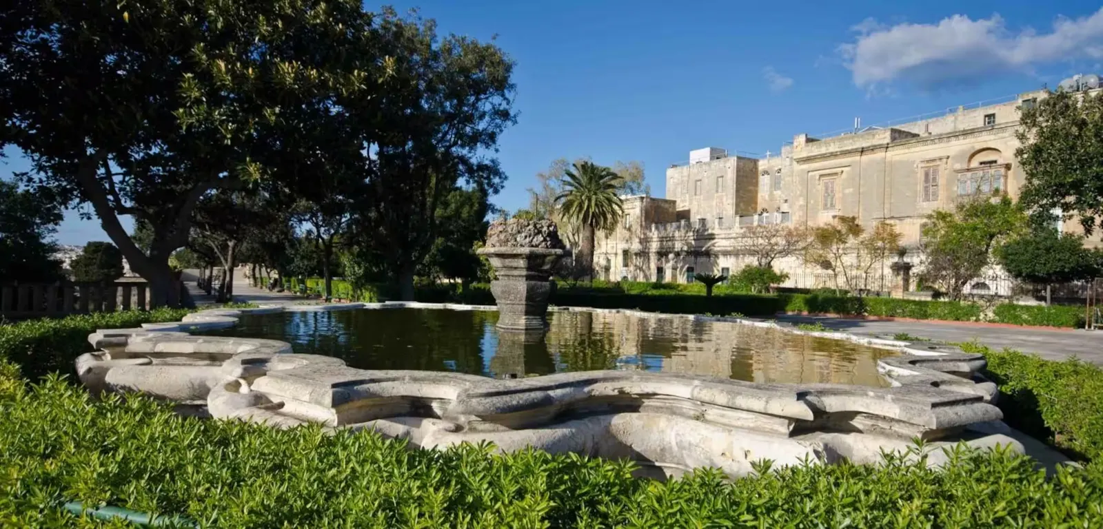 Garden pond and palms near Valletta